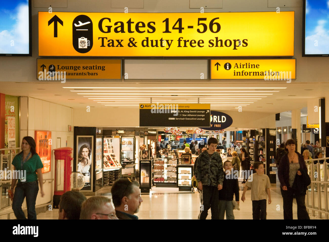 Travellers in the departure lounge, Terminal one Heathrow airport London UK Stock Photo