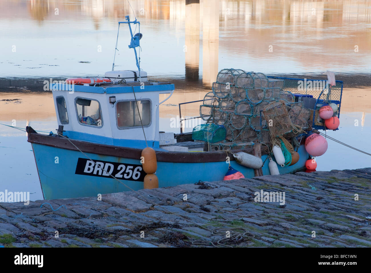 Fishing boat, tied up with pots ready, Dornie Stock Photo