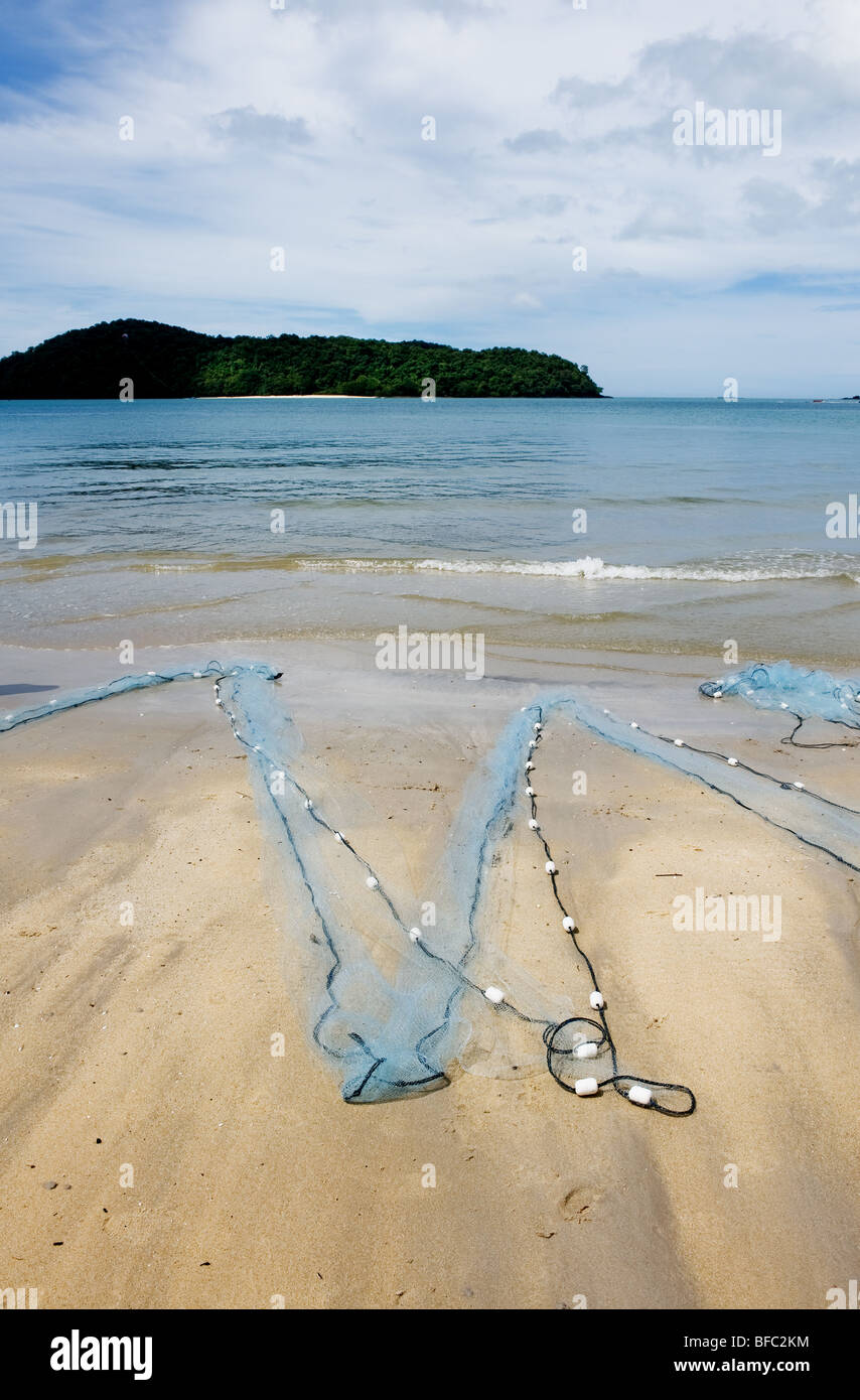 Fishing net lying on sand hi-res stock photography and images - Alamy