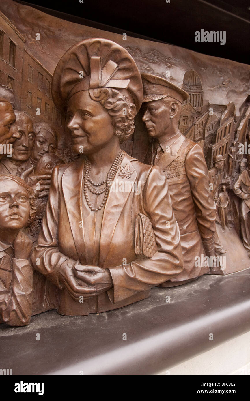 Bronze relief by sculptor Paul Day showing the Queen Mother and King George VI meeting people involved in the London Blitz. Stock Photo