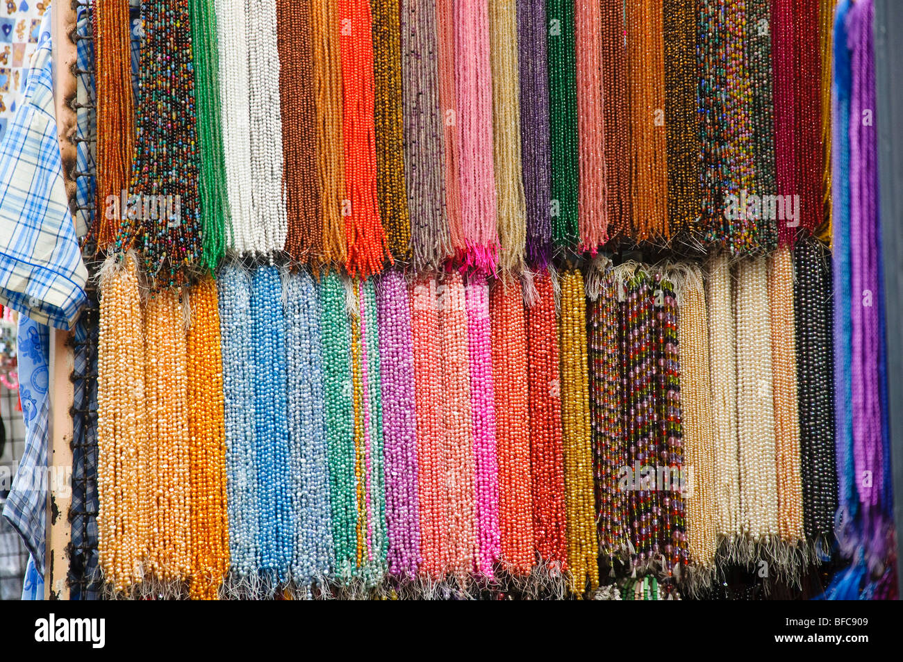 Beads, colored gems, pearls and stones for sale in Chinatown, Bangkok, Thailand Stock Photo