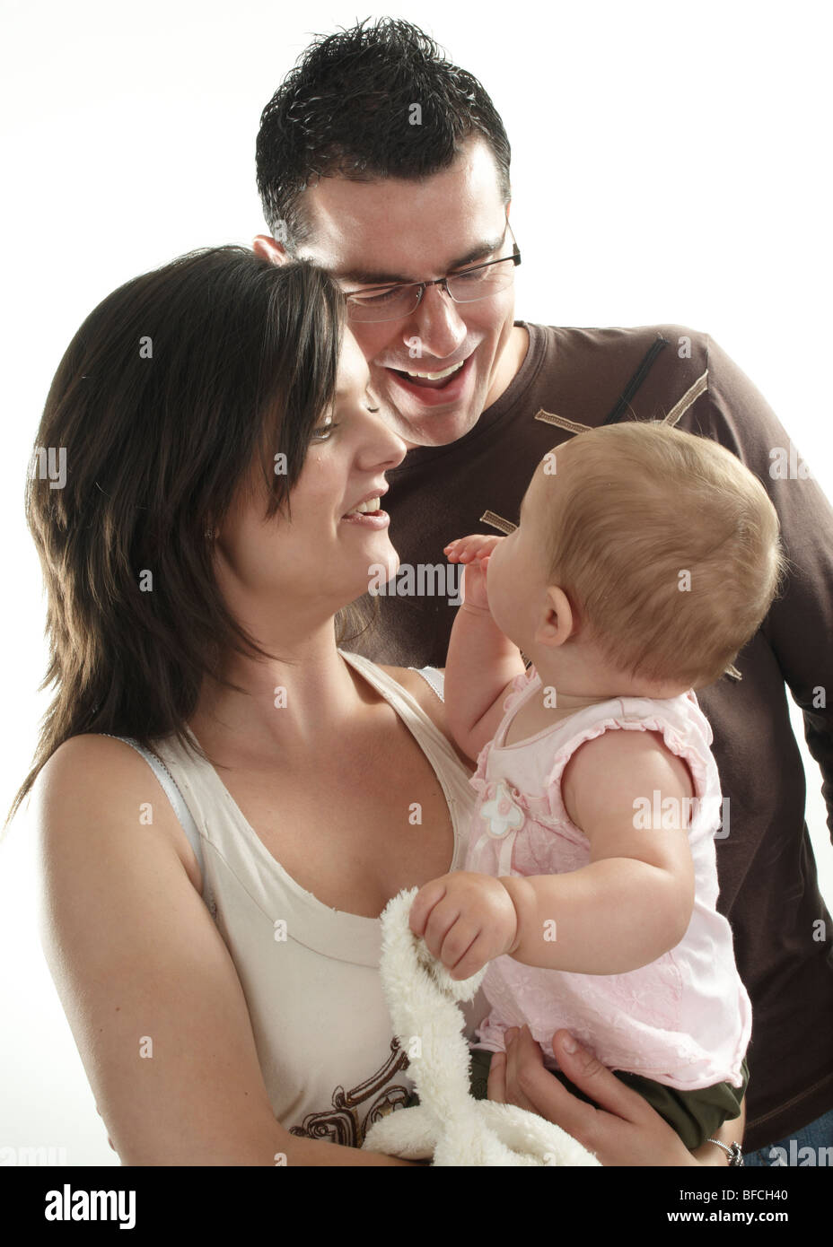 family portrait of mum, dad and baby girl Stock Photo
