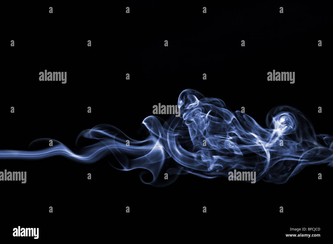 Smoke swirl on black background Stock Photo