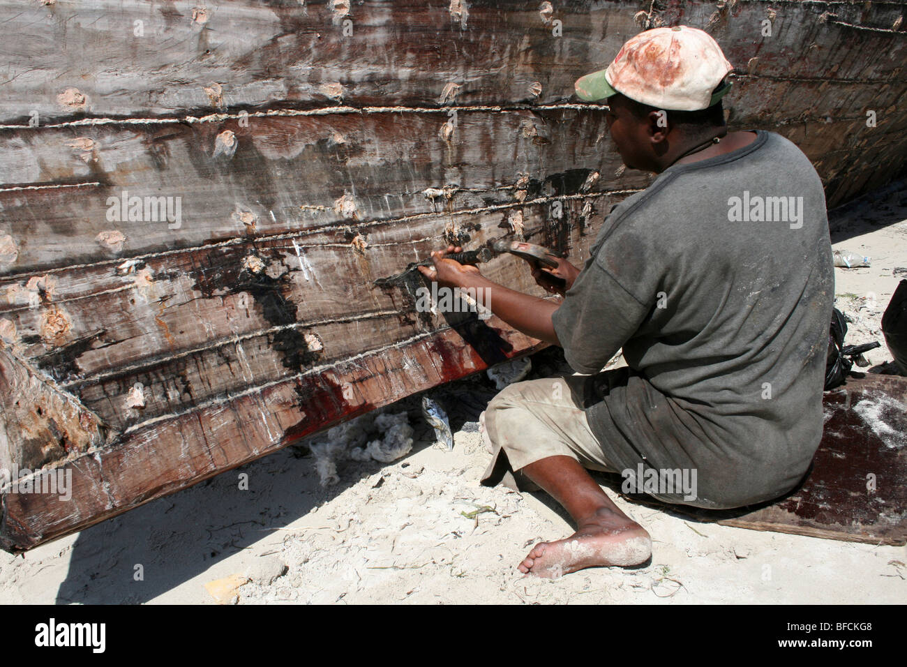 Fisherman Repairing Boat At Kivukoni Fish Market, Dar-Es-Salaam, Tanzania Stock Photo