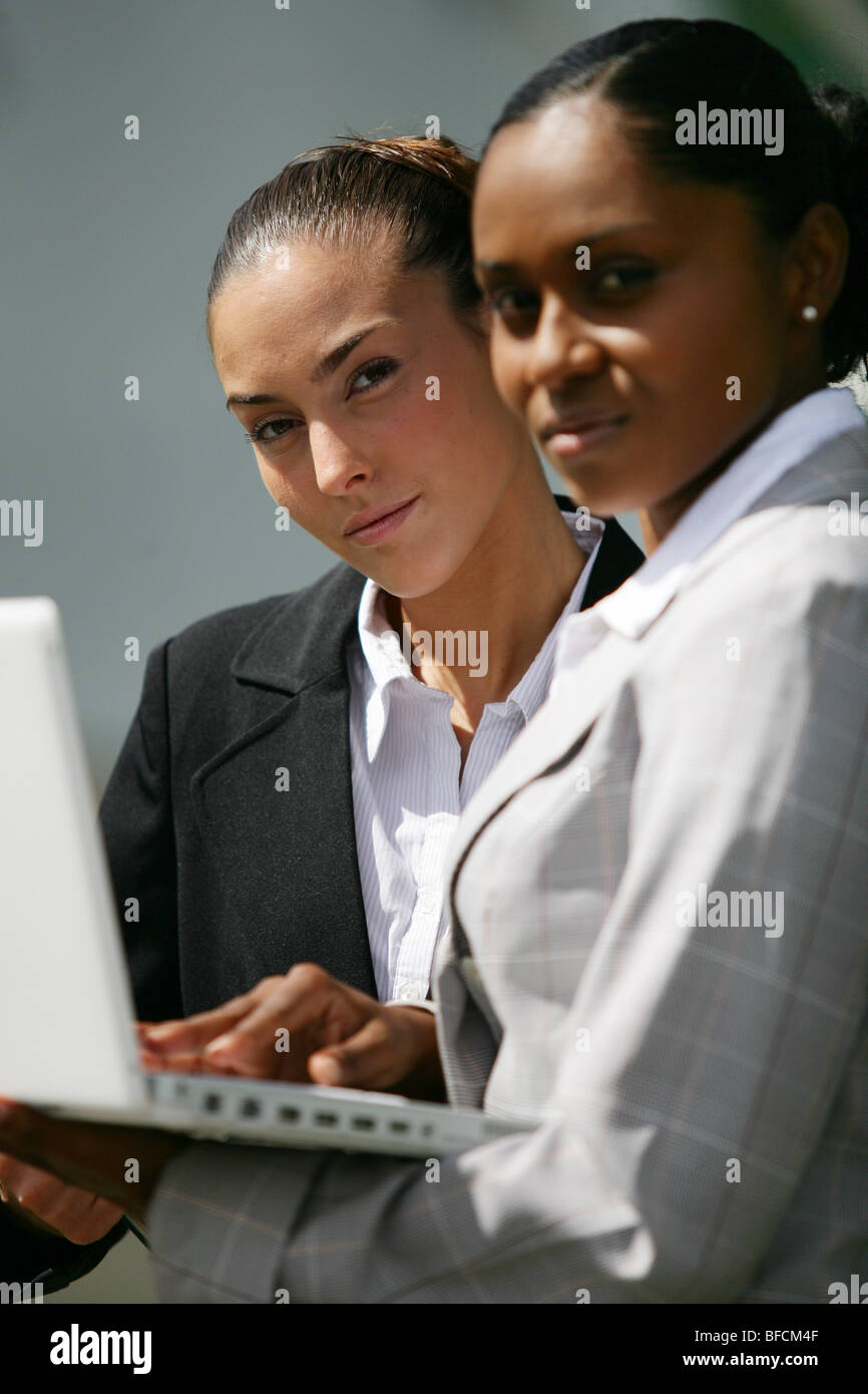 two businesswomen checking informations Stock Photo