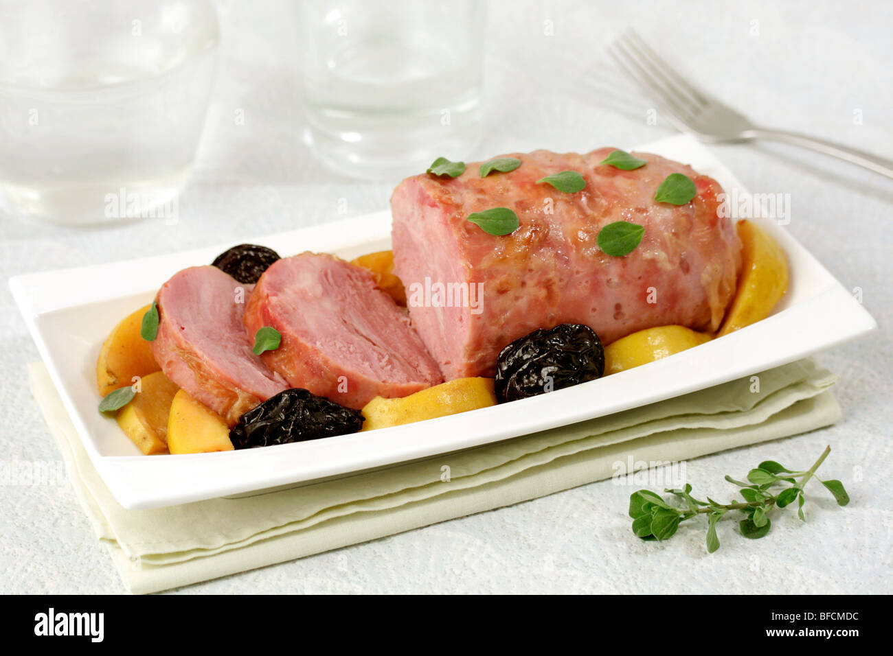 Pork knuckle with quince. Recipe available Stock Photo Alamy