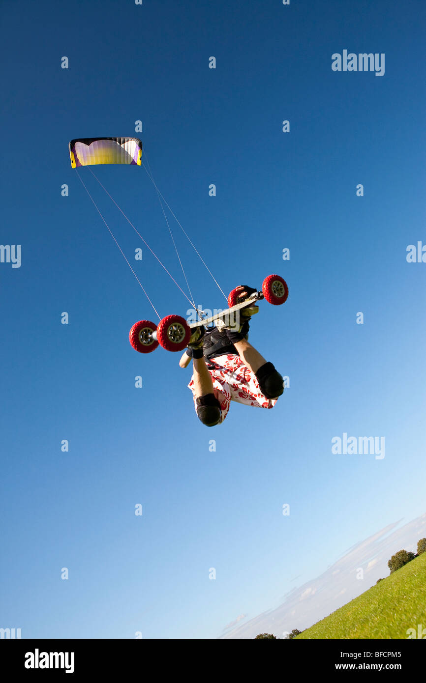 Extreme sport, freestyle kite landboarding, flying inland in open field