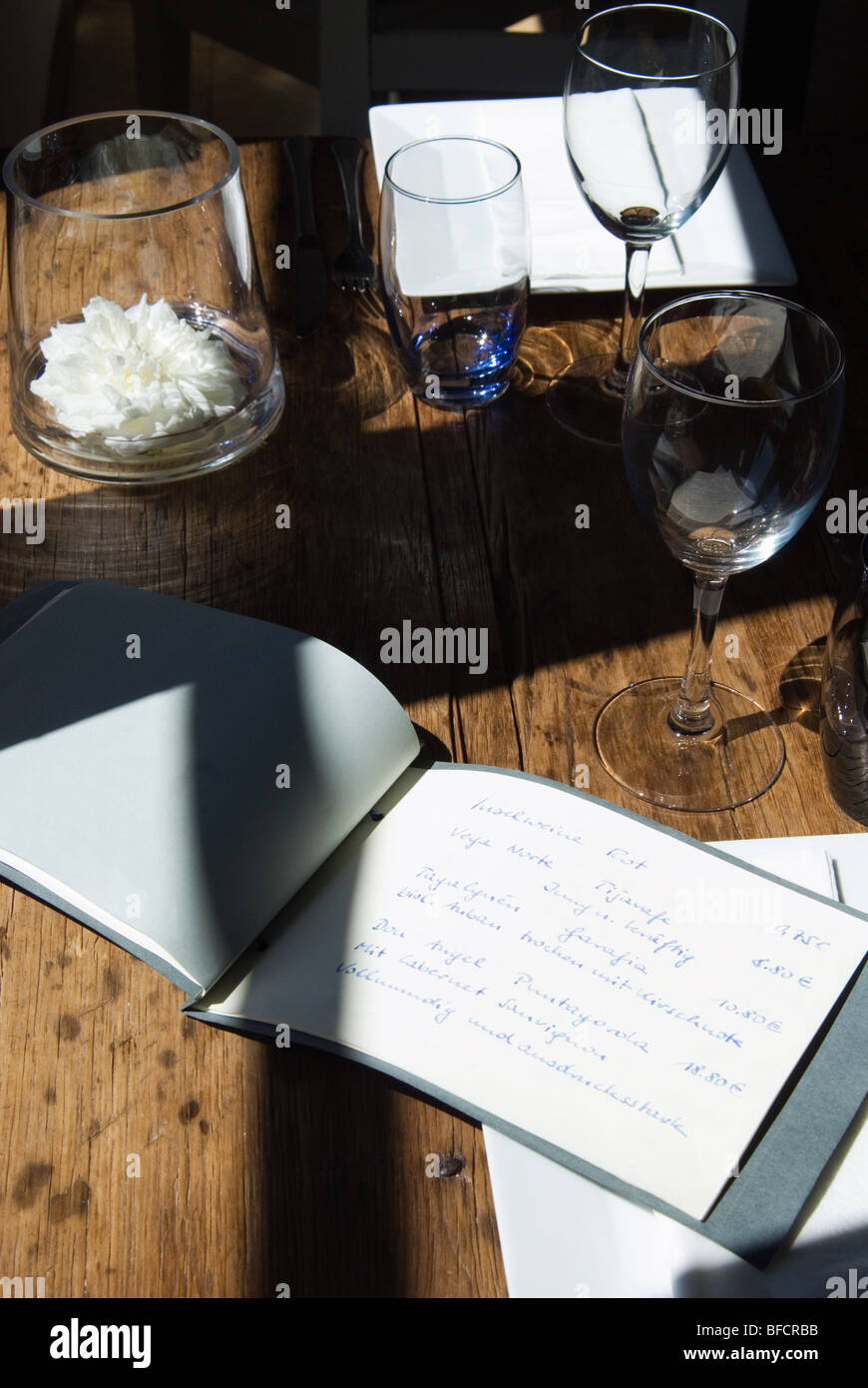 Rustic table with glasses and menus Stock Photo Alamy