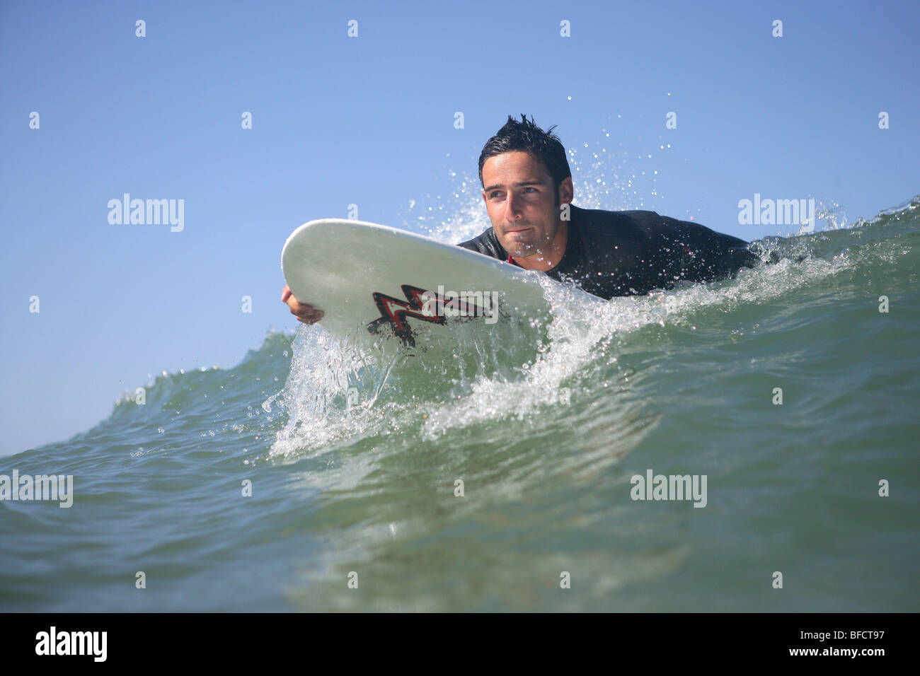 Surfer riding a wave Stock Photo - Alamy