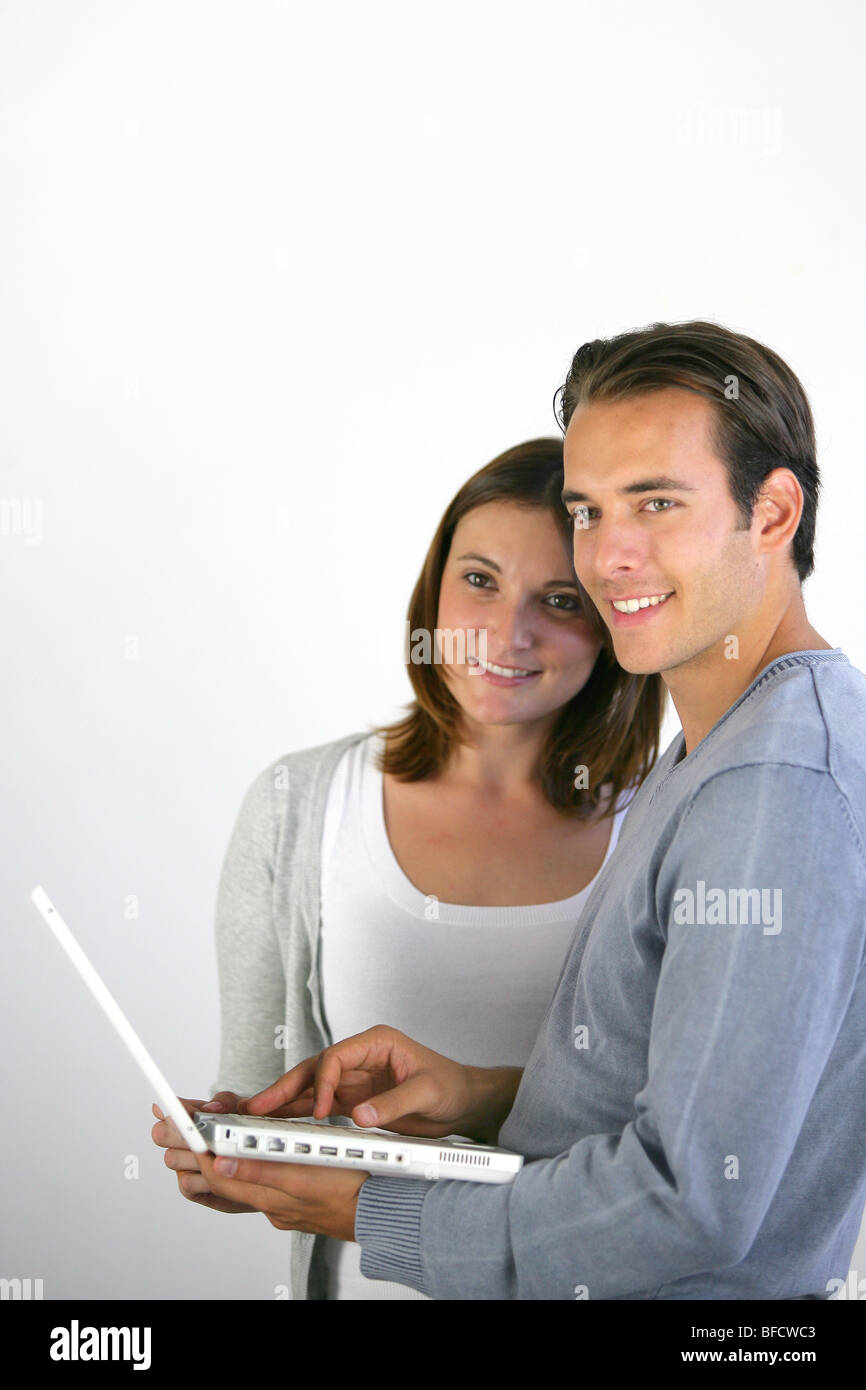 Couple using their laptop Stock Photo - Alamy