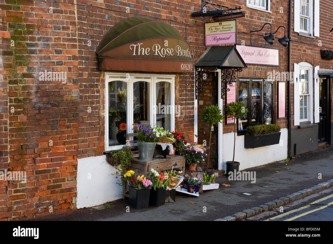 flower display in front of a florist shop High Street Cookham Berkshire UK Stock Photo