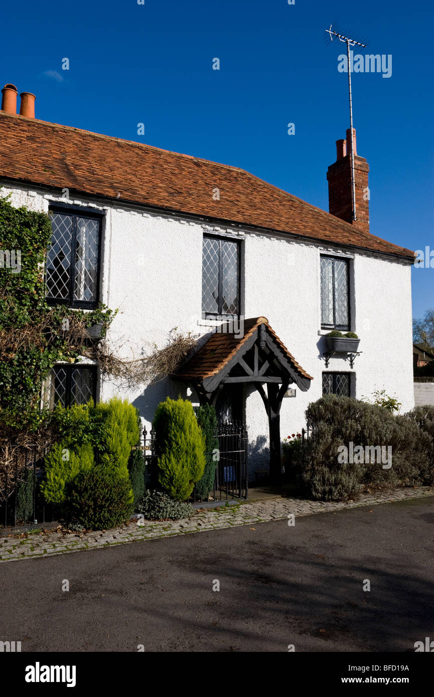 covered entrance, porch and front door to a white building in Cookham