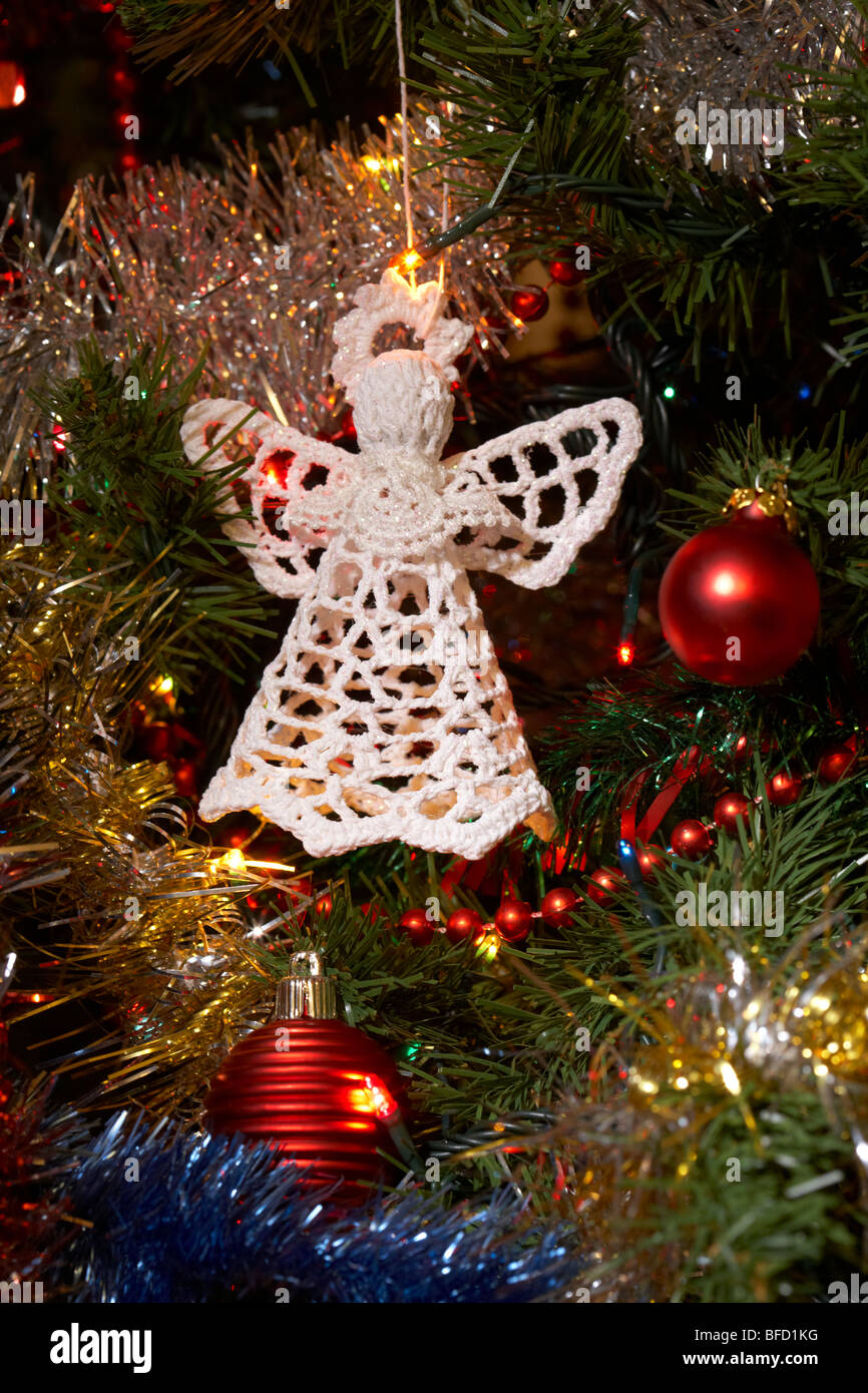 A white angel mannequin with white Christmas tree and cage Stock Photo -  Alamy