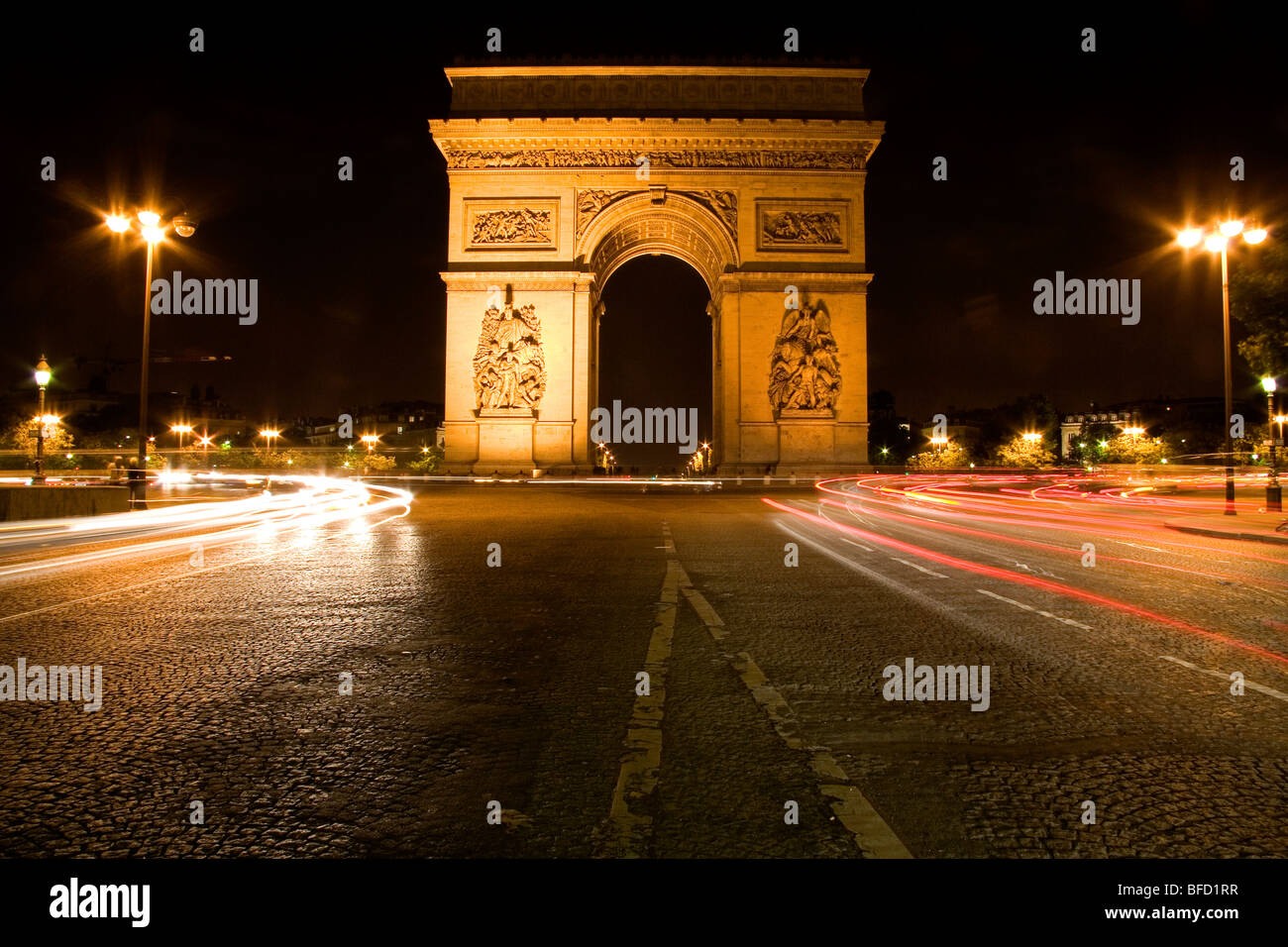 Arc de Triomphe lit at night stands in the centre of the Place Charles de Gaulle, Paris, France. Stock Photo