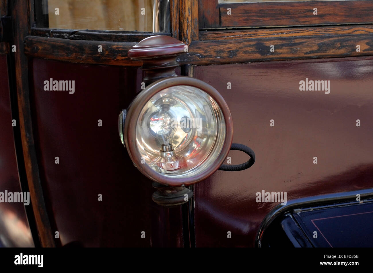 Vintage electric car Chicago Electric illustrating classic headlight assembly Orange, California, USA. Stock Photo