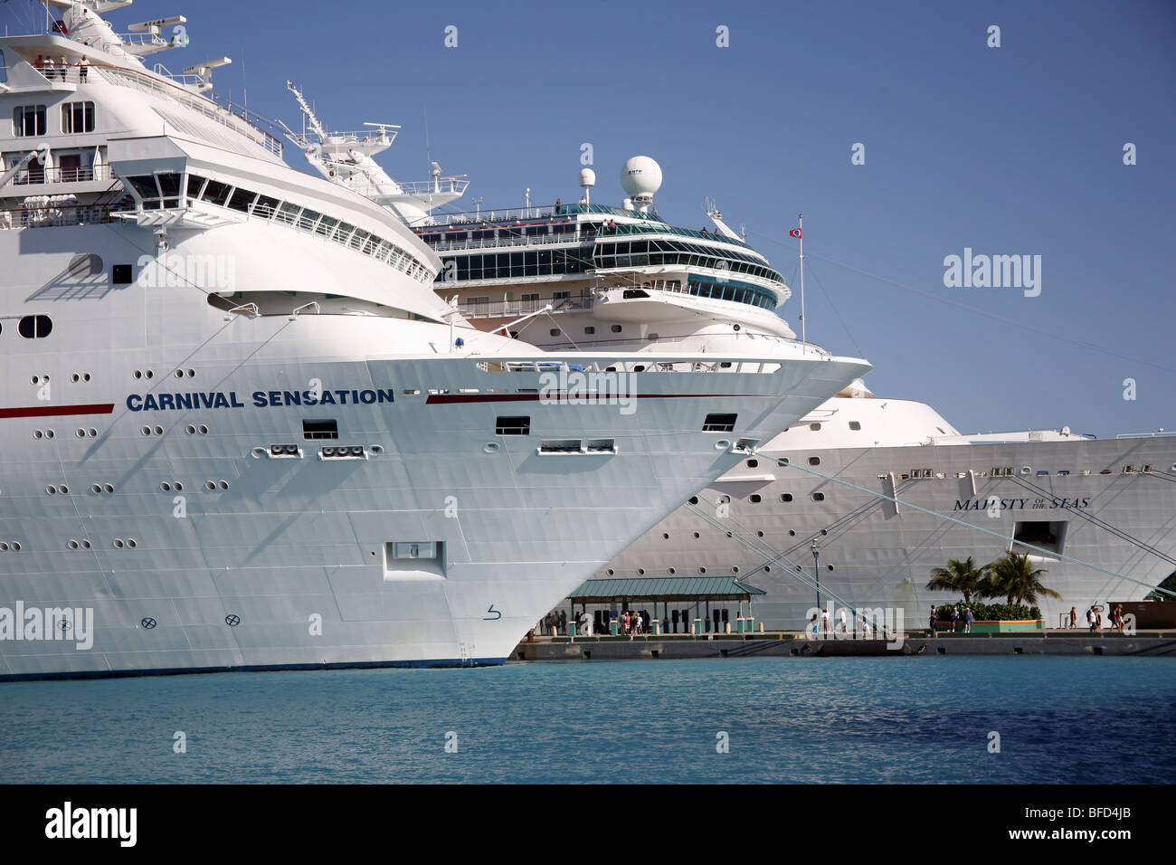 The Carnival Sensation and Majesty of the Seas cruise ship in Nassau Harbour, Providence Island, in the Bahamas Stock Photo