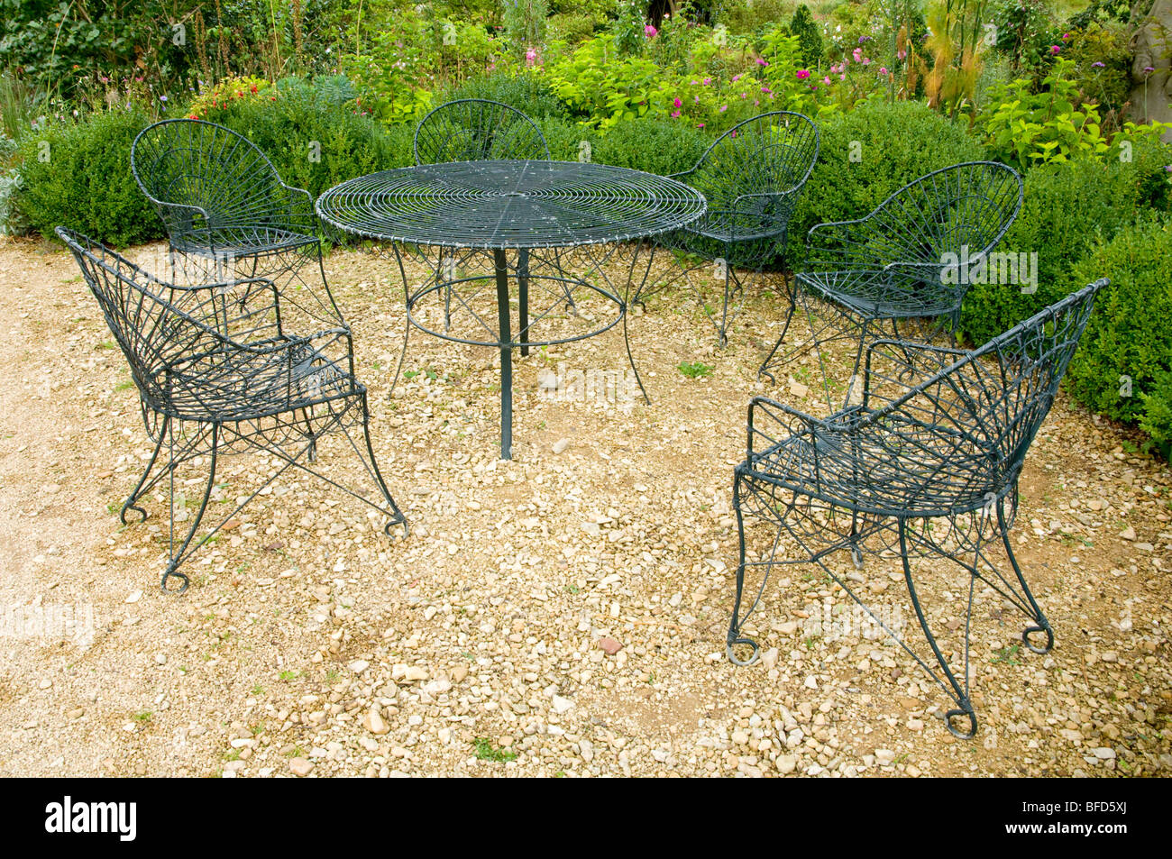 Iron work garden furniture at Hanham Court Gardens, Cotswolds, England Stock Photo
