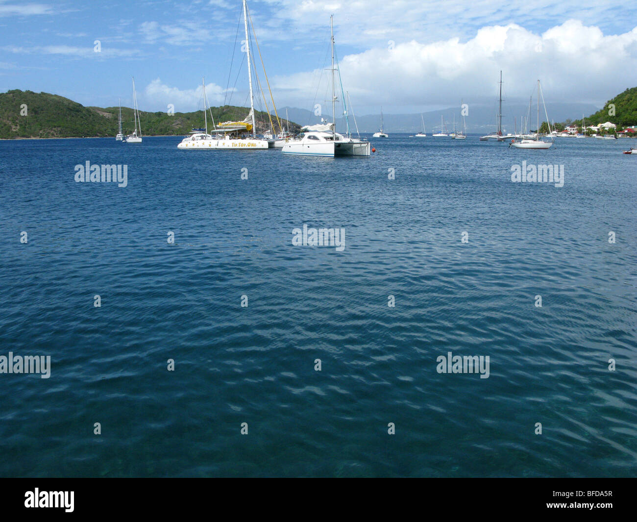 island, moored boats, sailing, fishing, carabbean islands,  blue sky, fine weather, a turquoise blue water Stock Photo