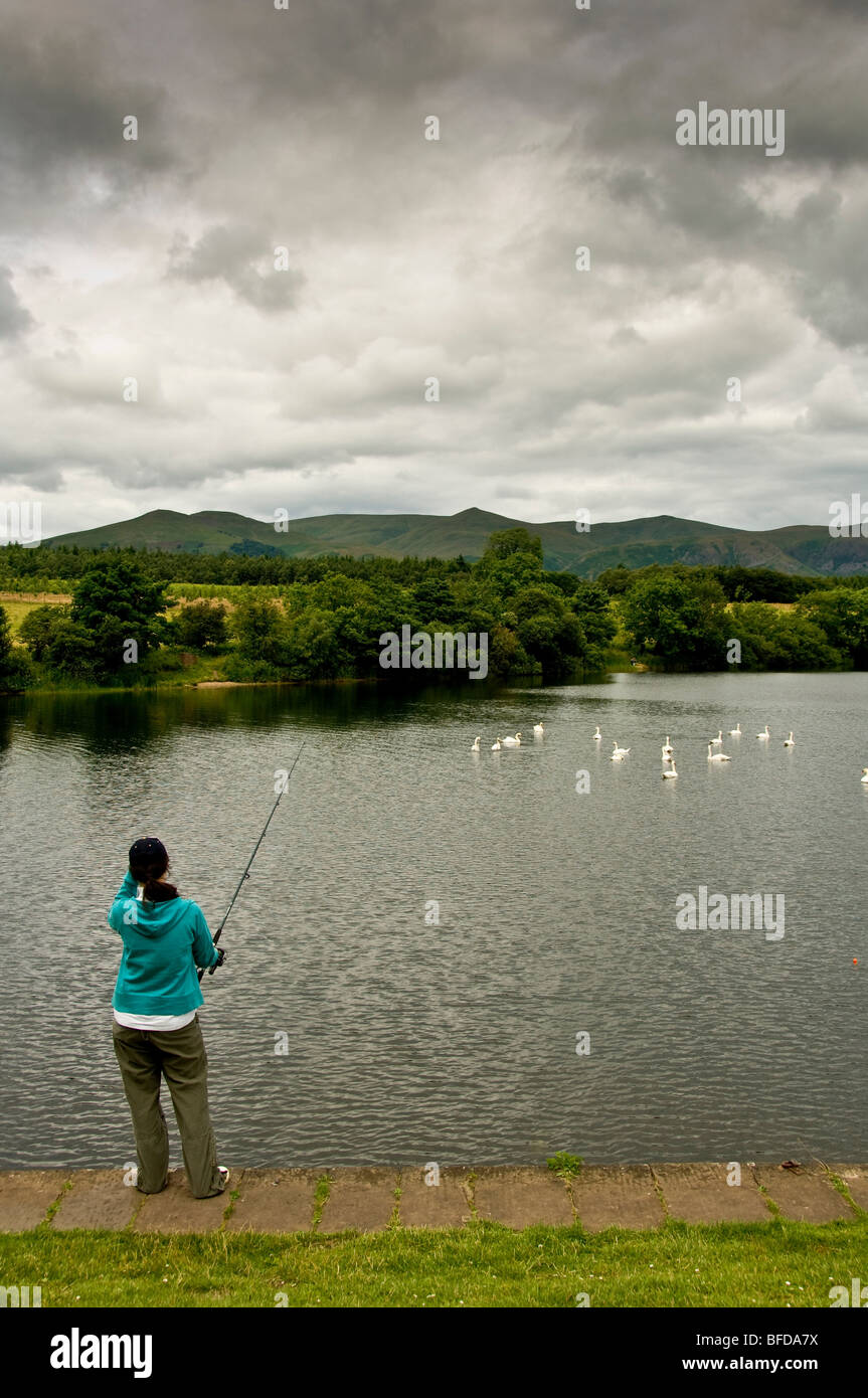 Woman fishing on the bank of Gartmorn Dam in Scotland Stock Photo - Alamy
