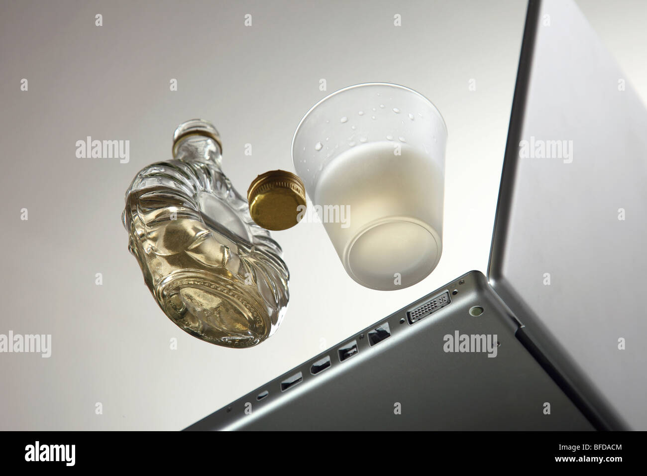 Notebook with a bottle of alcohol Stock Photo