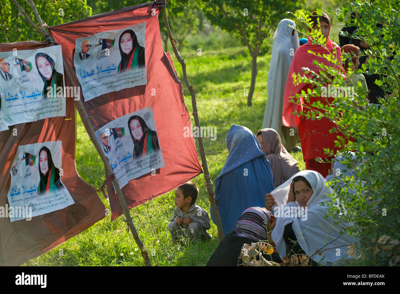 Posters of a woman running for Afghan president, are displayed at a small campaign rally in an outlying district of Kabul, Afgha Stock Photo