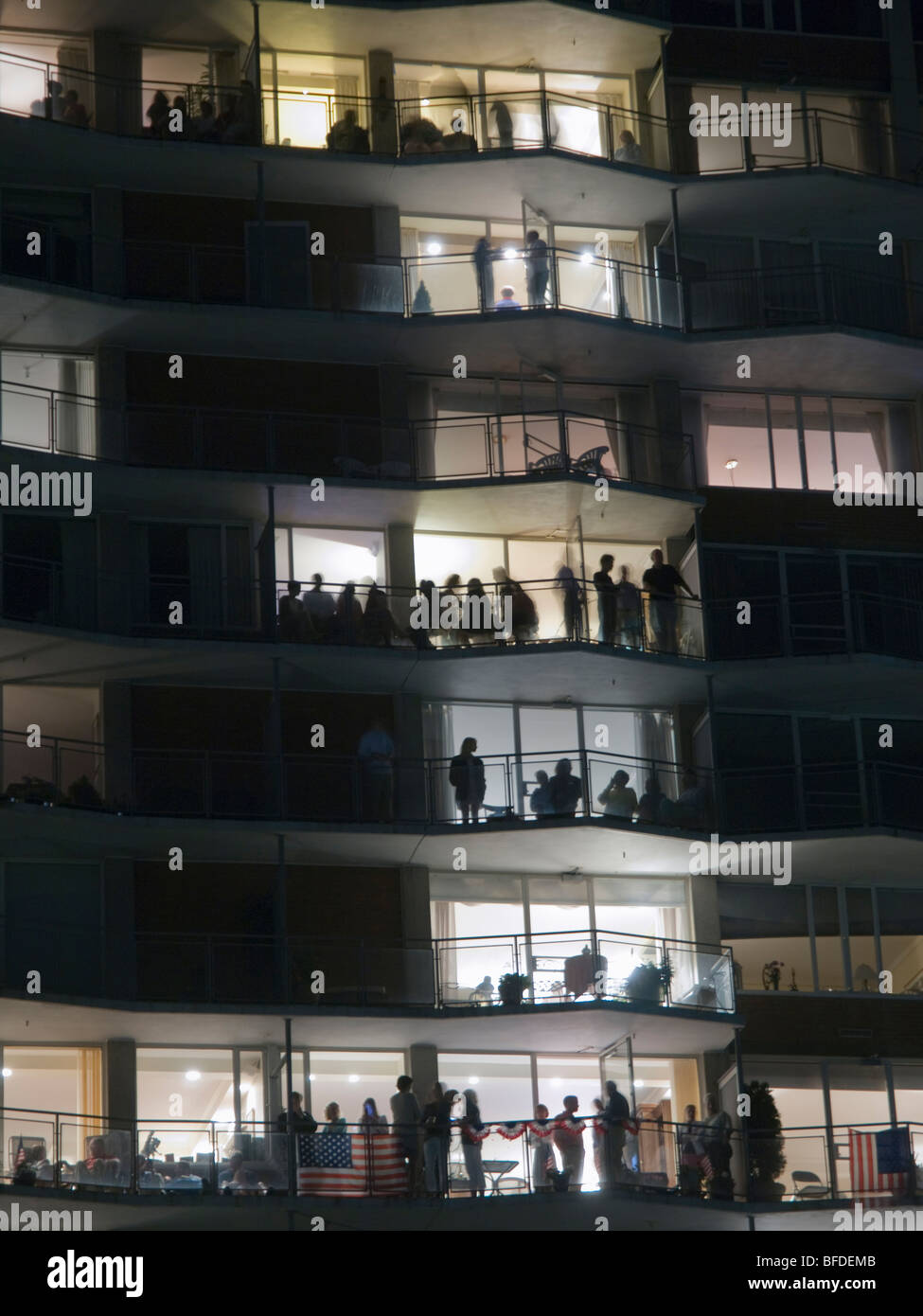 Apartment dwellers watch July 4th fireworks Stock Photo Alamy