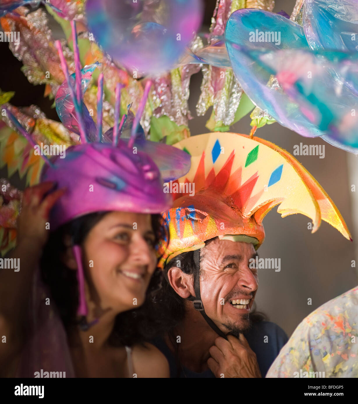 A woman and man check their costumes before a parade in Santa Barbara