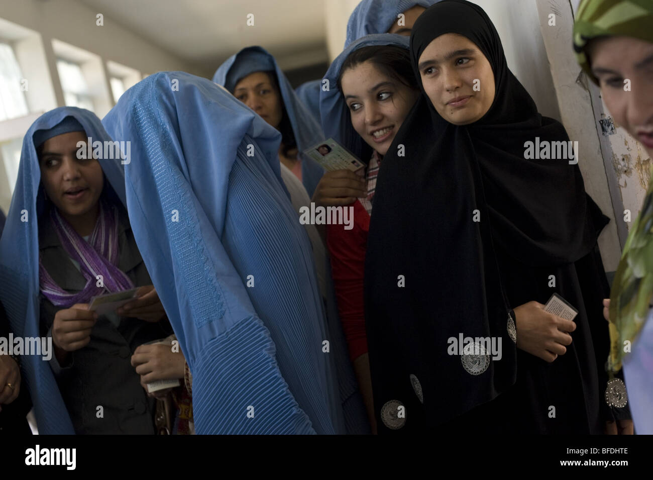 Young Afghan women vote at a local school for presidential and