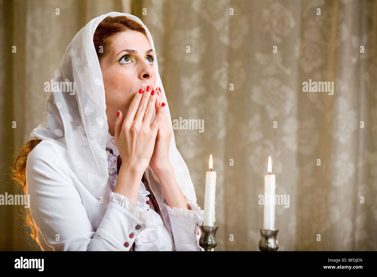 Woman blessing on Shabbat candles Stock Photo Alamy