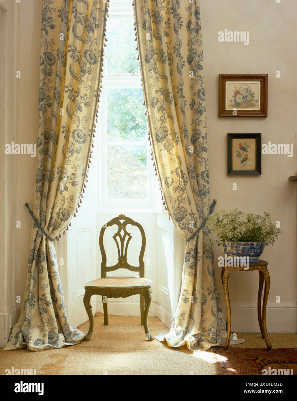 Antique Chair In Front Of Tall Window With Pastel Blue Patterned