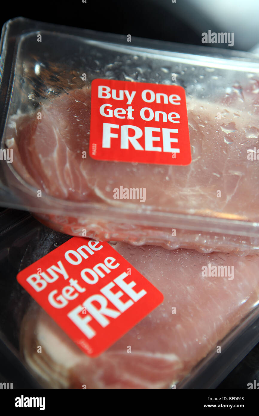 Buy one get one free packets of bacon which are special offers from the large supermarket Stock Photo