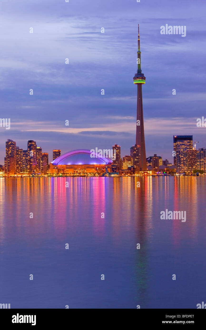 Skyline of Toronto with CN Tower and Rogers Centre at dusk, Toronto, Ontario, Canada Stock Photo