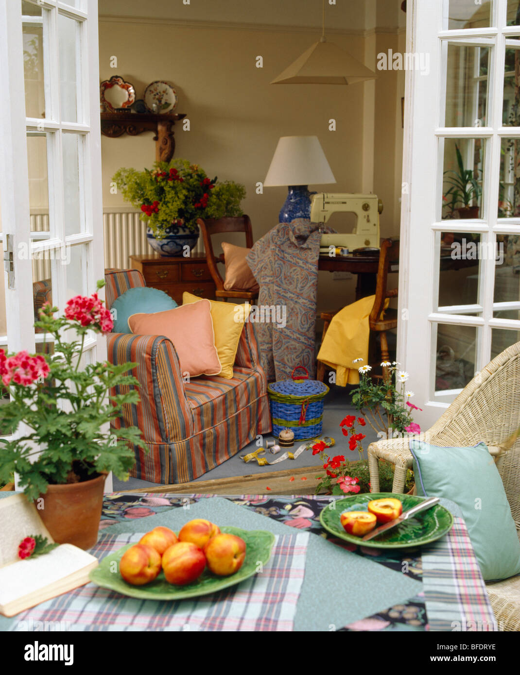 Patio with French doors open to traditional living room Stock Photo Alamy