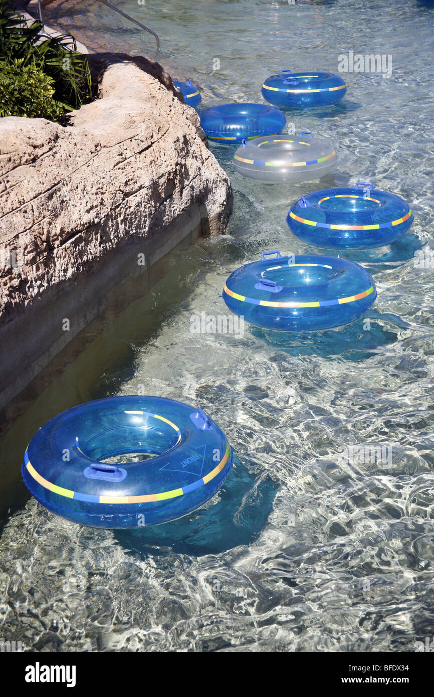 Rubber rings floating in a lazy river Stock Photo