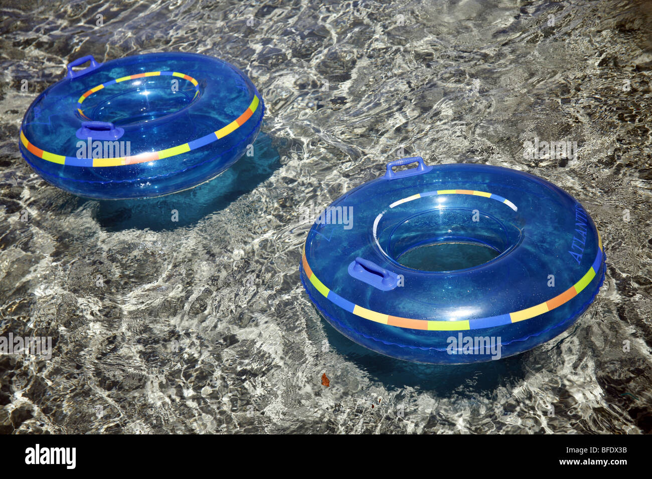 Rubber rings floating in a lazy river Stock Photo