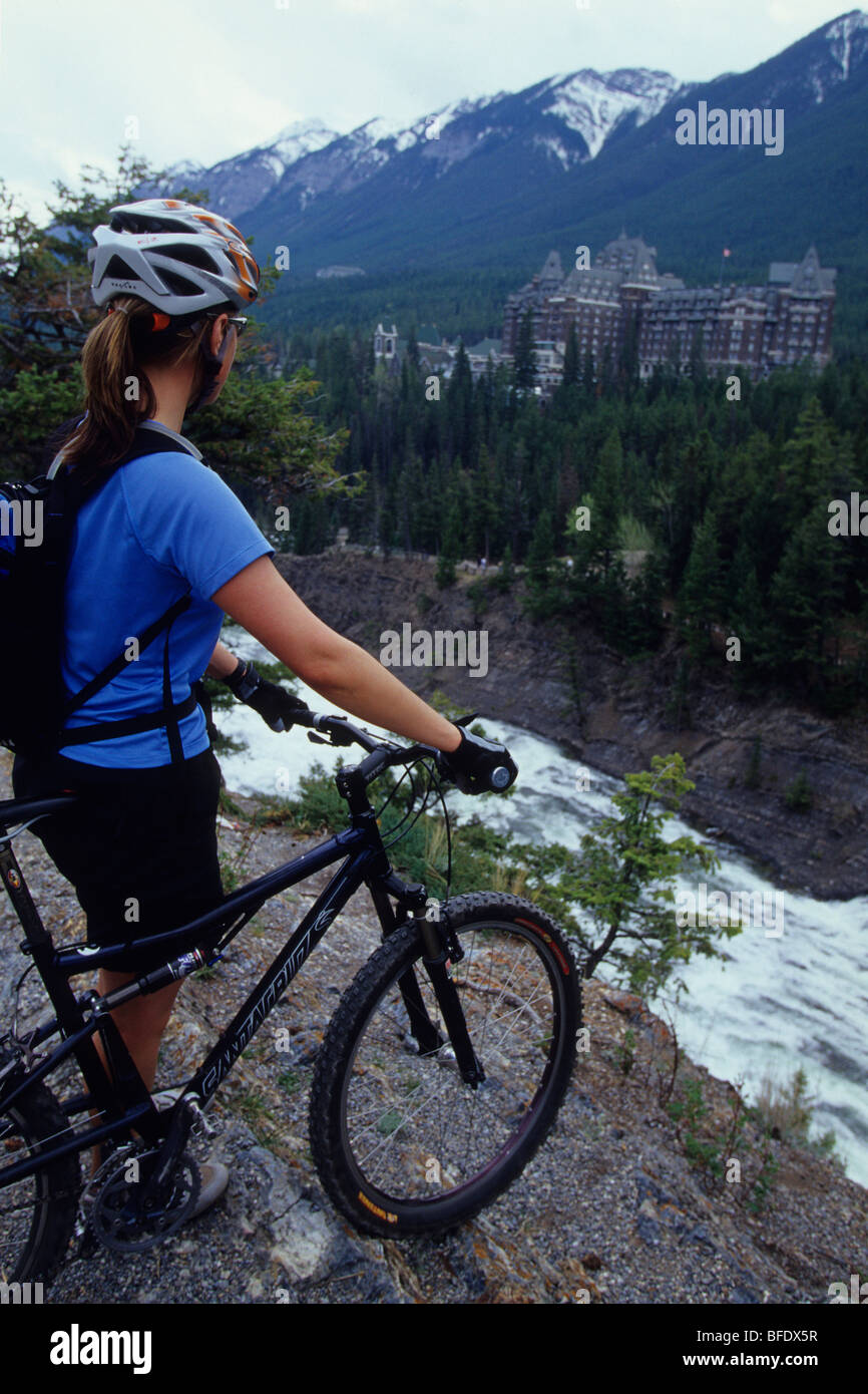 A woman with her mountain bike in Banff National Park, Rocky Mountains
