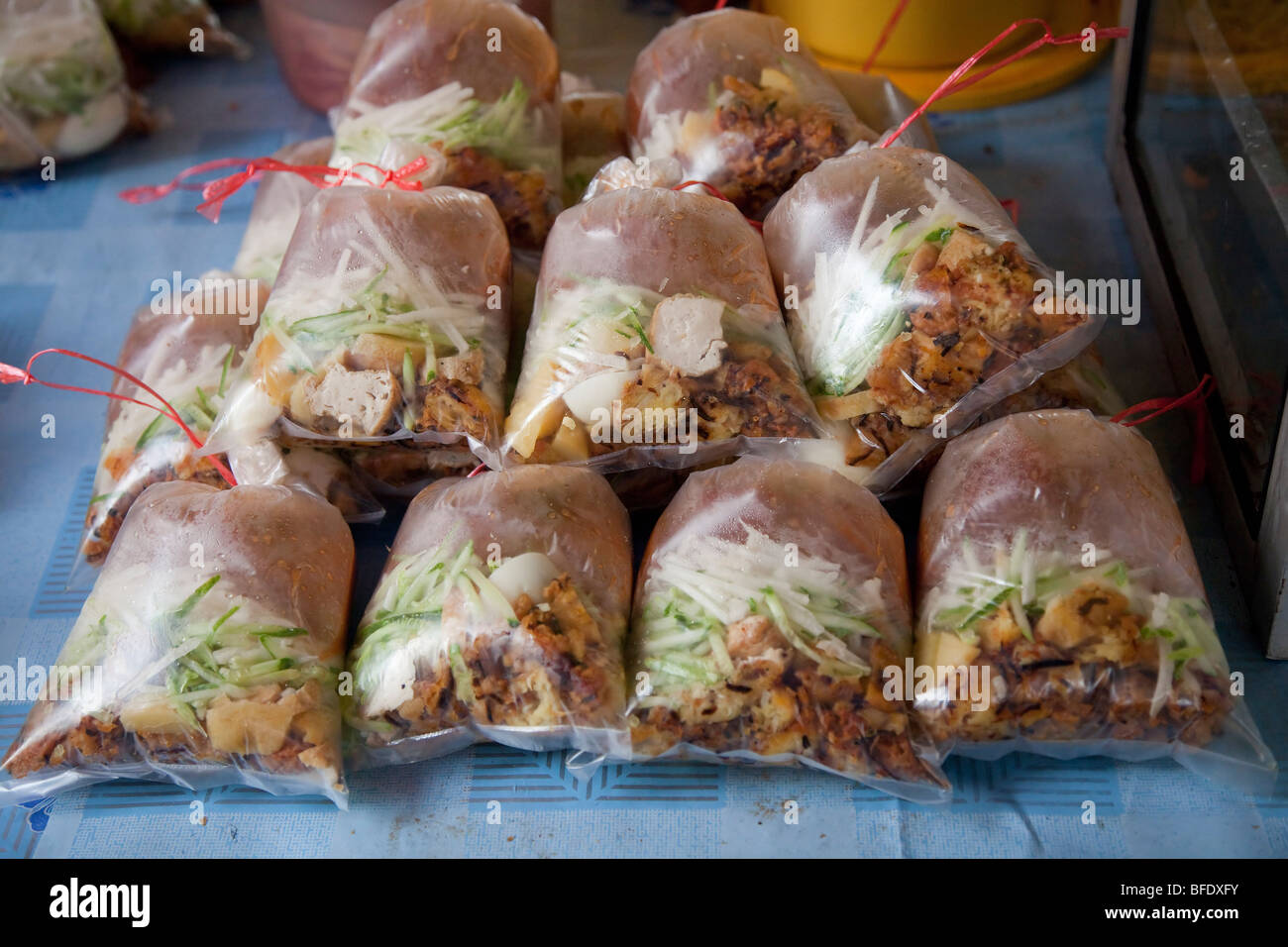 Malaysian Rojak take away dish 'dabough' on sale in a street market Stock Photo