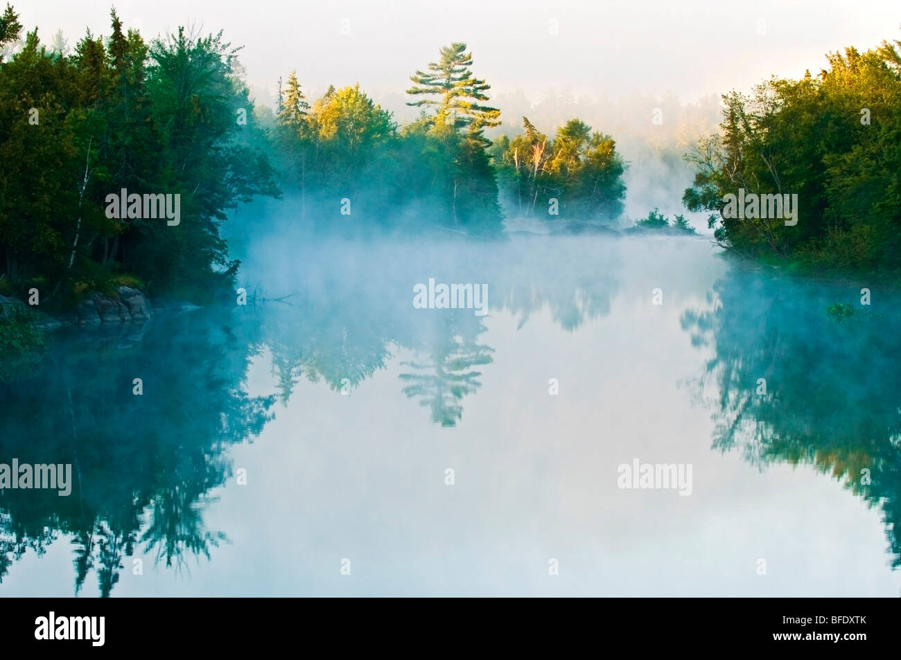 Fog at sunrise on Wahnapitae River, Killarney Provincial Park, Ontario, Canada Stock Photo