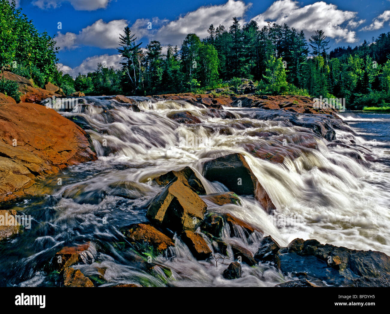 Small waterfall flowing over rocks, Onaping Falls, Ontario, Canada Stock Photo