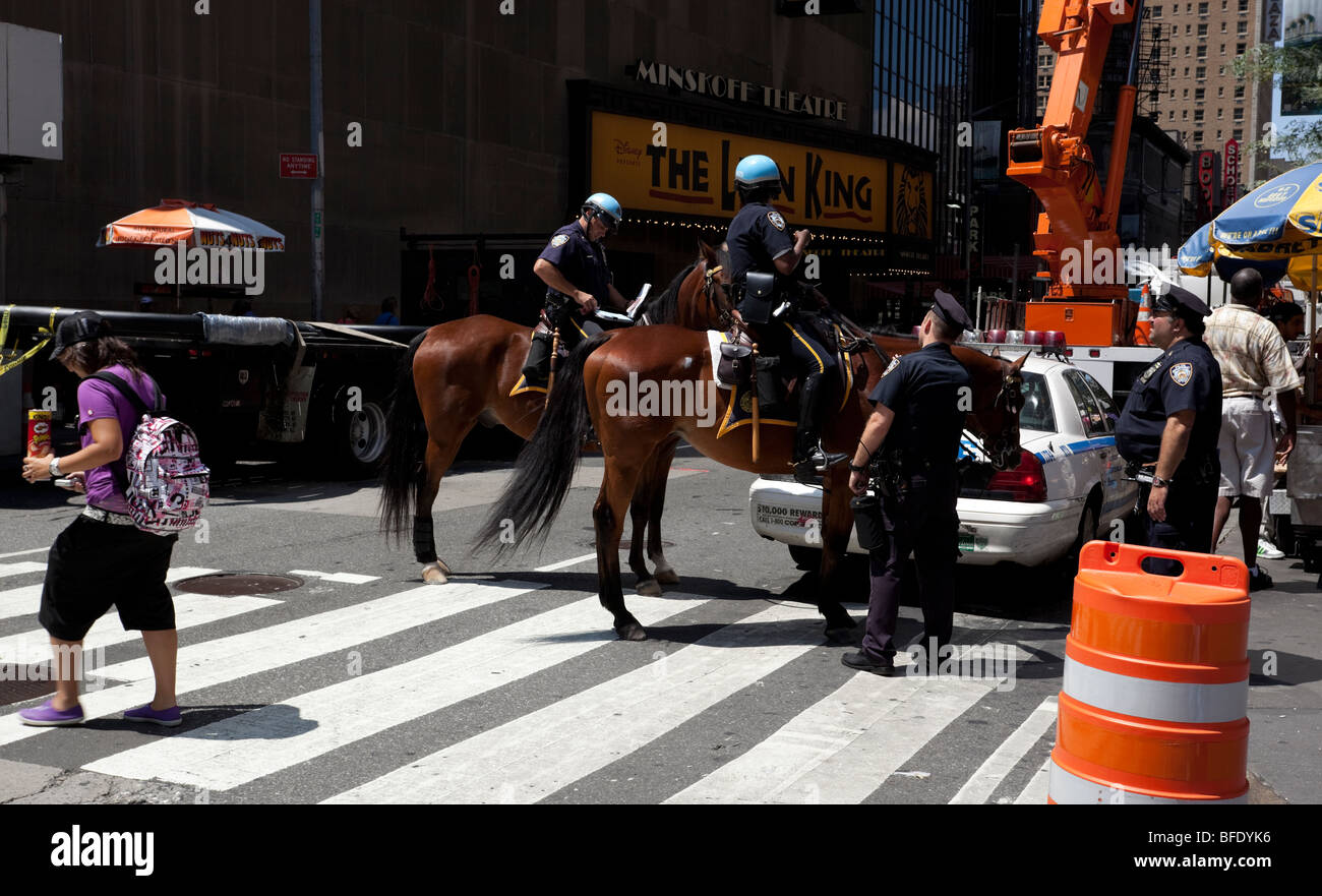 Police officers patrolling Times Square, New York City, USA. Stock Photo