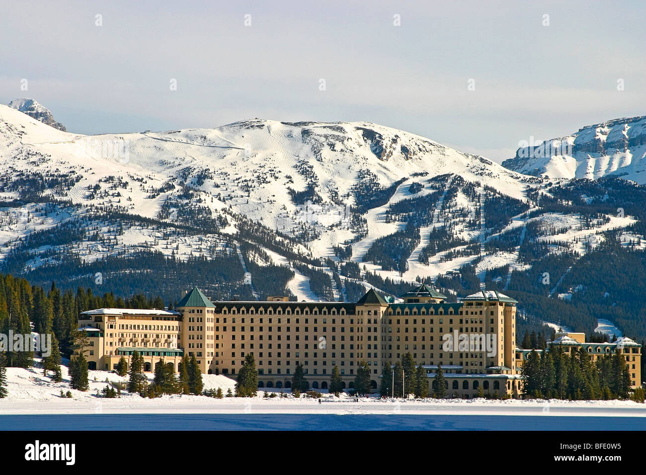Chateau Lake Louise, a Fairmont hotel, seen from the frozen lake. Lake ...