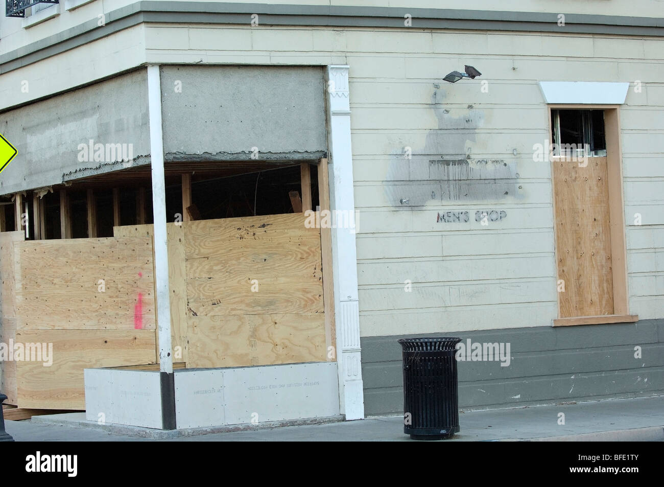 A business storefront with boarded up windows. (Concepts: new business, going out of business, fire/natural damage, repair). Stock Photo