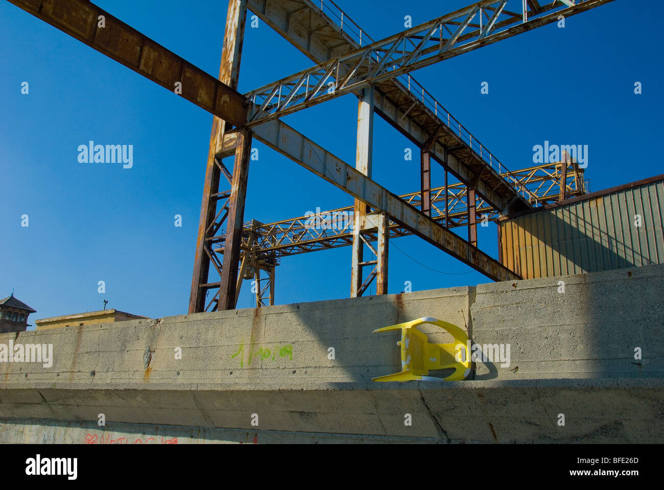 The steelwork of a crane in a disused boat yard in Savona Northern Italy Stock Photo