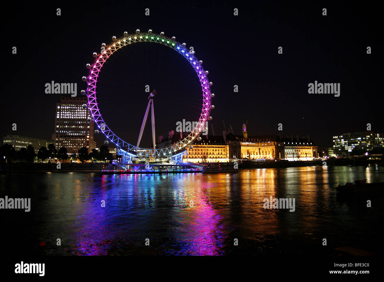 Millennium Wheel in London, England, illuminated in rainbow lights to celebrate gay Pride in London Stock Photo