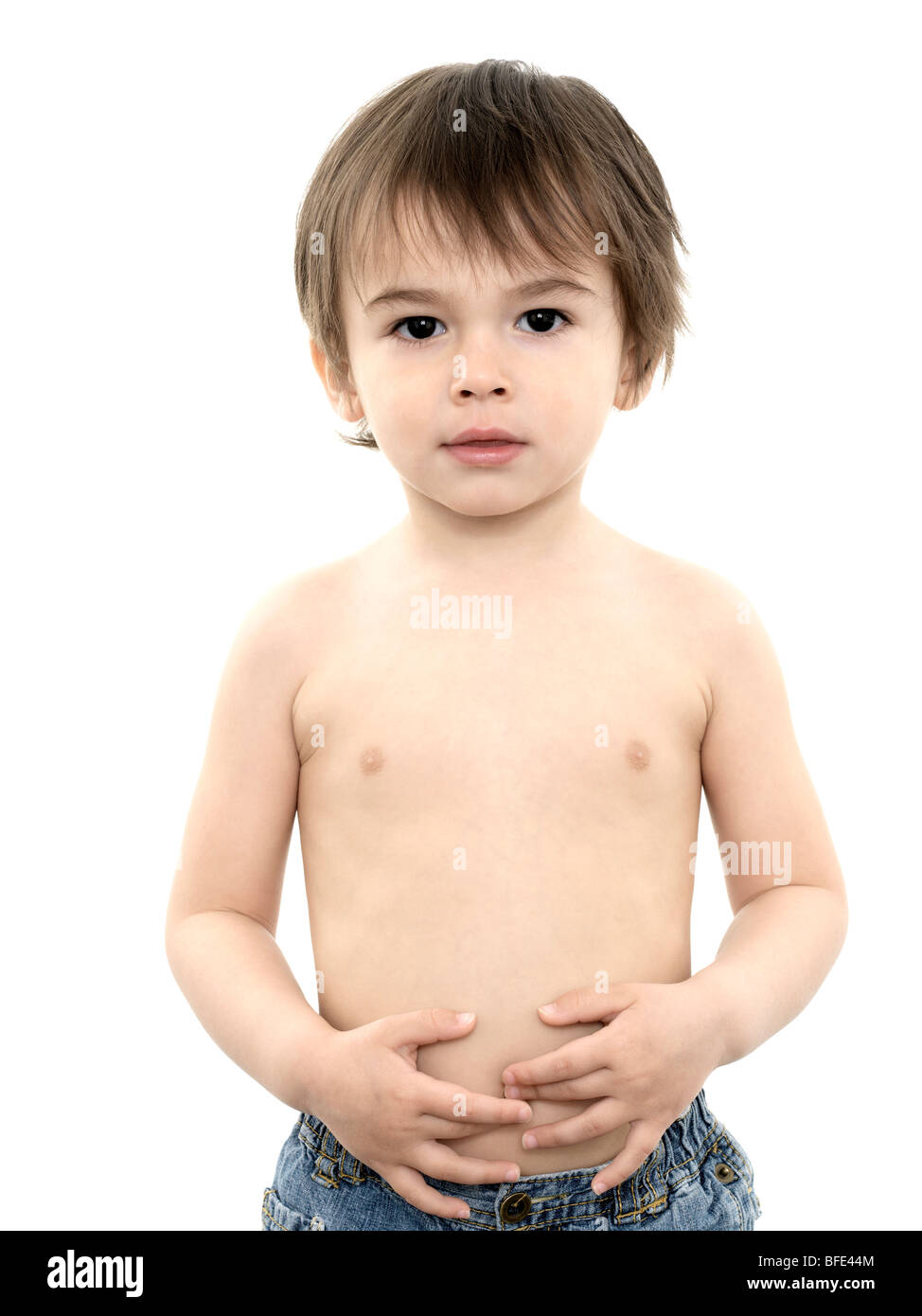 Two and half year old boy wearing jeans and no shirt against a white  background Stock Photo - Alamy