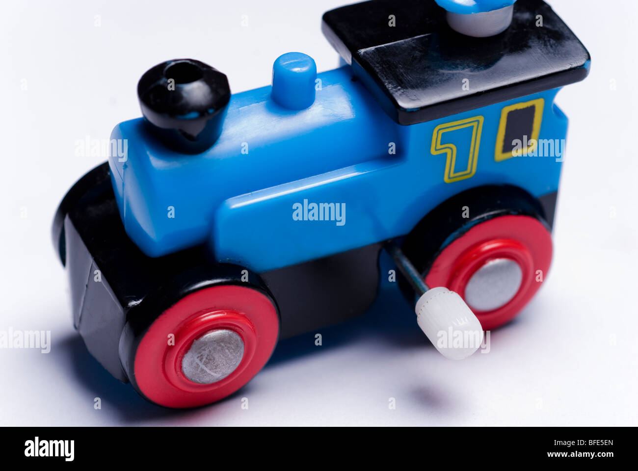 Wind-up blue toy train isolated on a white background Stock Photo