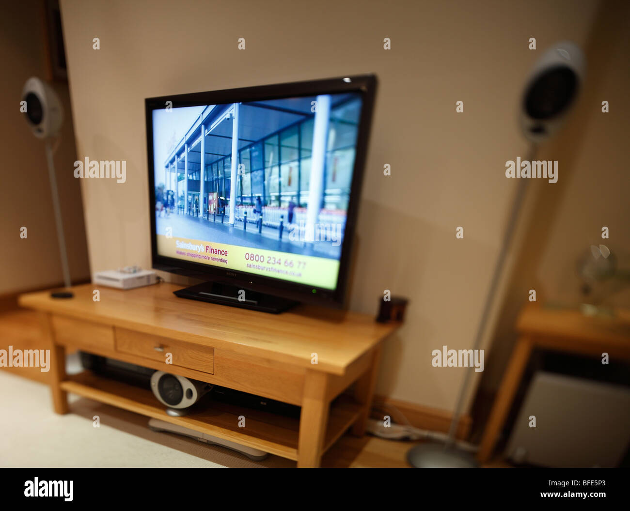 Flat screen TV with surround sound. (note: image has a shallow depth of field). Stock Photo