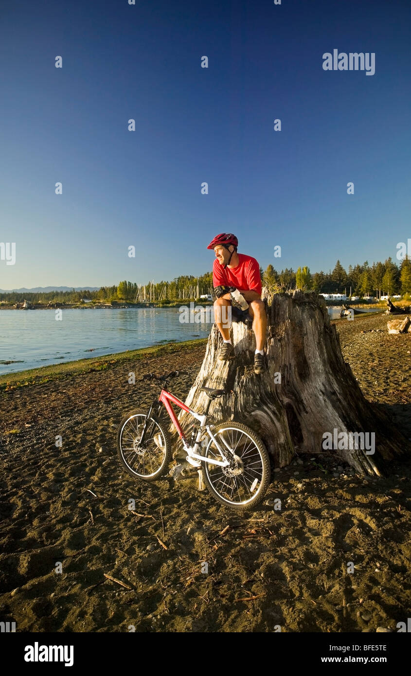 mountain biker relaxing and enjoying the view of Strait, Black