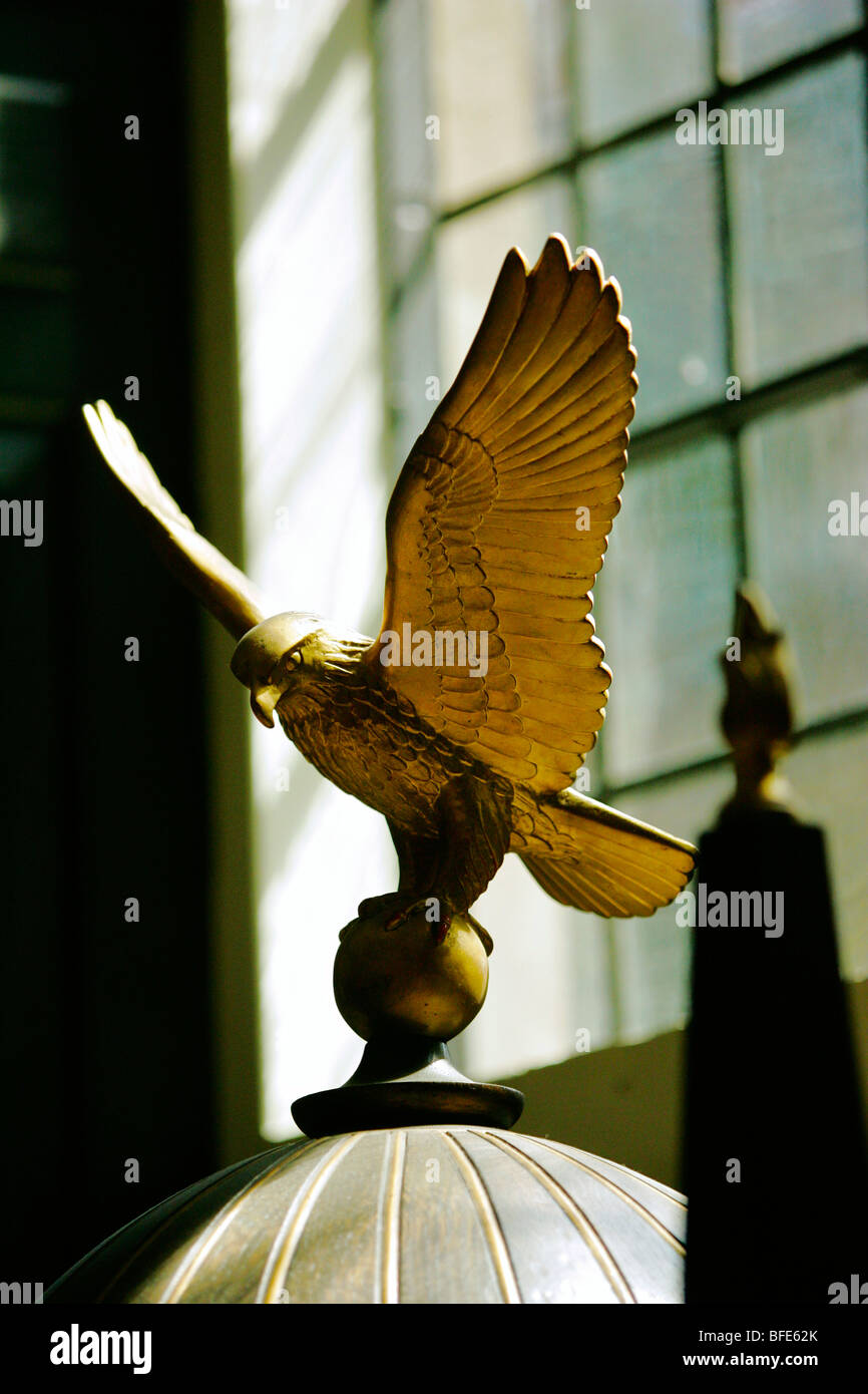 A golden falcon or bird of prey in St Clements Danes church in London the RAF church Stock Photo