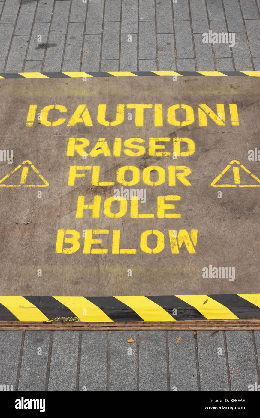 Caution Raised Floor Hole Below Warning Sign Danger Trip Hazard On